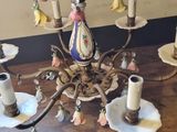 a chandelier that is sitting on a wooden table