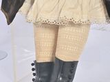 a doll that is sitting in a clear box