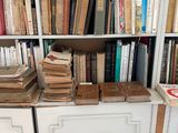 many books that are on the shelves in the room