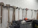 a lot of tools hanging on the wall in the garage