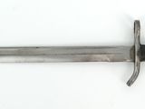 a knife that is laying on a white surface