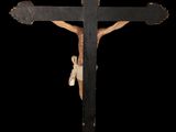 an old wooden crucifix with a cross on a black background