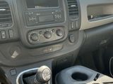 a dashboard of a vehicle with a remote control in it