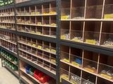 a lot of shelves that have many different types of tools on them