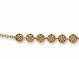 a gold necklace with three small beads on a chain