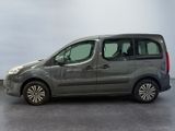 the grey van is parked in a room with a gray floor
