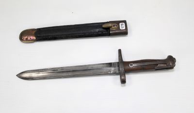 two different types of knives on a white surface