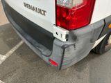 the rear end of a white van with the word renault painted on it