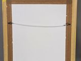 an image of a picture frame with a piece of paper taped to it