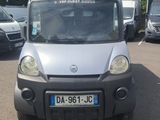 a small van that is parked in a parking lot