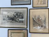 four framed pictures on the wall of a blue room