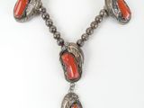 a close up of a necklace on a mannequin mannequin