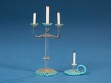 two candles that are sitting on a table