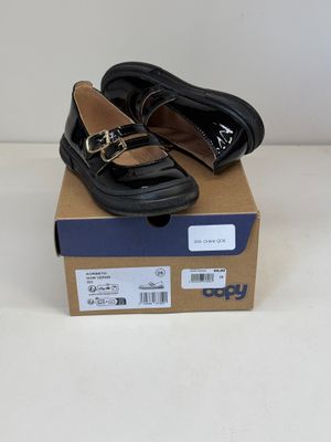 Mocassins Ugg pour femme, neufs, en cuir noir avec des boucles dorées