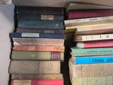 a lot of books in a box on the floor