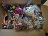 a cardboard box filled with assorted toys and other items