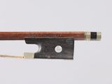 a close up of a violin bow with a string attached to it