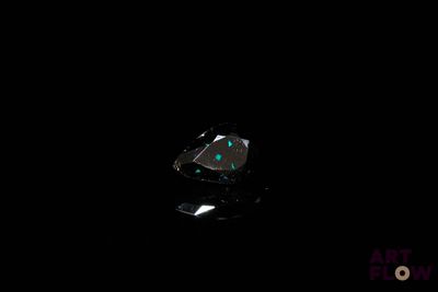 an image of a black diamond in the dark