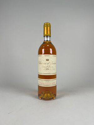 a bottle of wine sitting on top of a white table