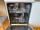 a dishwasher in the middle of a kitchen