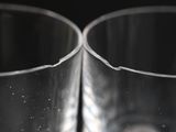 a close up of two empty glasses on a table