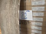 a large stack of boxes with a price tag on it
