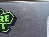 a close up of a fire extinguisor sticker on the back of a car