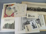 an assortment of old photographs and postcards on display on a table