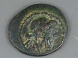 une vieille pièce de monnaie sur laquelle figure l'image d'un homme à cheval