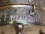 a close up of a metal object with a metal handle