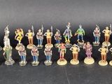 a lot of figurines that are sitting on a table