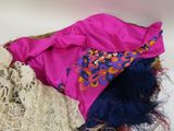 a pile of clothing that is laying on a table