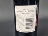 a bottle of wine that is sitting on a table