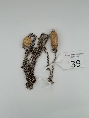 a necklace that has two charms attached to it