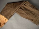 an image of a pair of brown pants on a gray surface