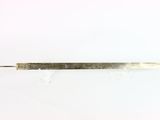 a close up of a small metal object on a white surface
