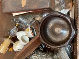 a box full of antique items on the floor