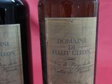 two bottles of wine sitting next to each other on a table