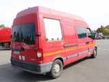 a red van that is parked in a parking lot