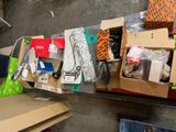 many boxes of assorted items sitting on the floor
