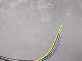 two wires that are connected to a laptop on a table