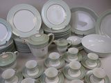 many plates and cups that are sitting on a table