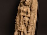 a statue of a woman holding a child in her arms