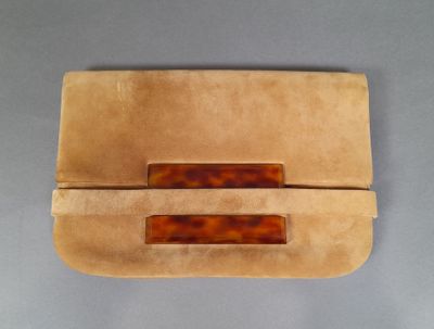 tan leather clutch bag with tortoises on the front