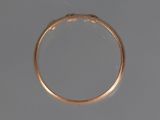 a close up of a gold ring with a diamond in the middle