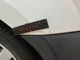 a sticker on the side of a white car