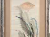 painting of a fish and seaweed in a frame on a wall