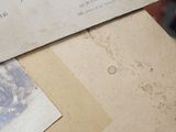 a pile of old papers sitting on top of a table