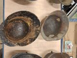 many old frying pans on a cart in the kitchen
