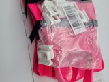 a pink bag that has a bunch of wires in it